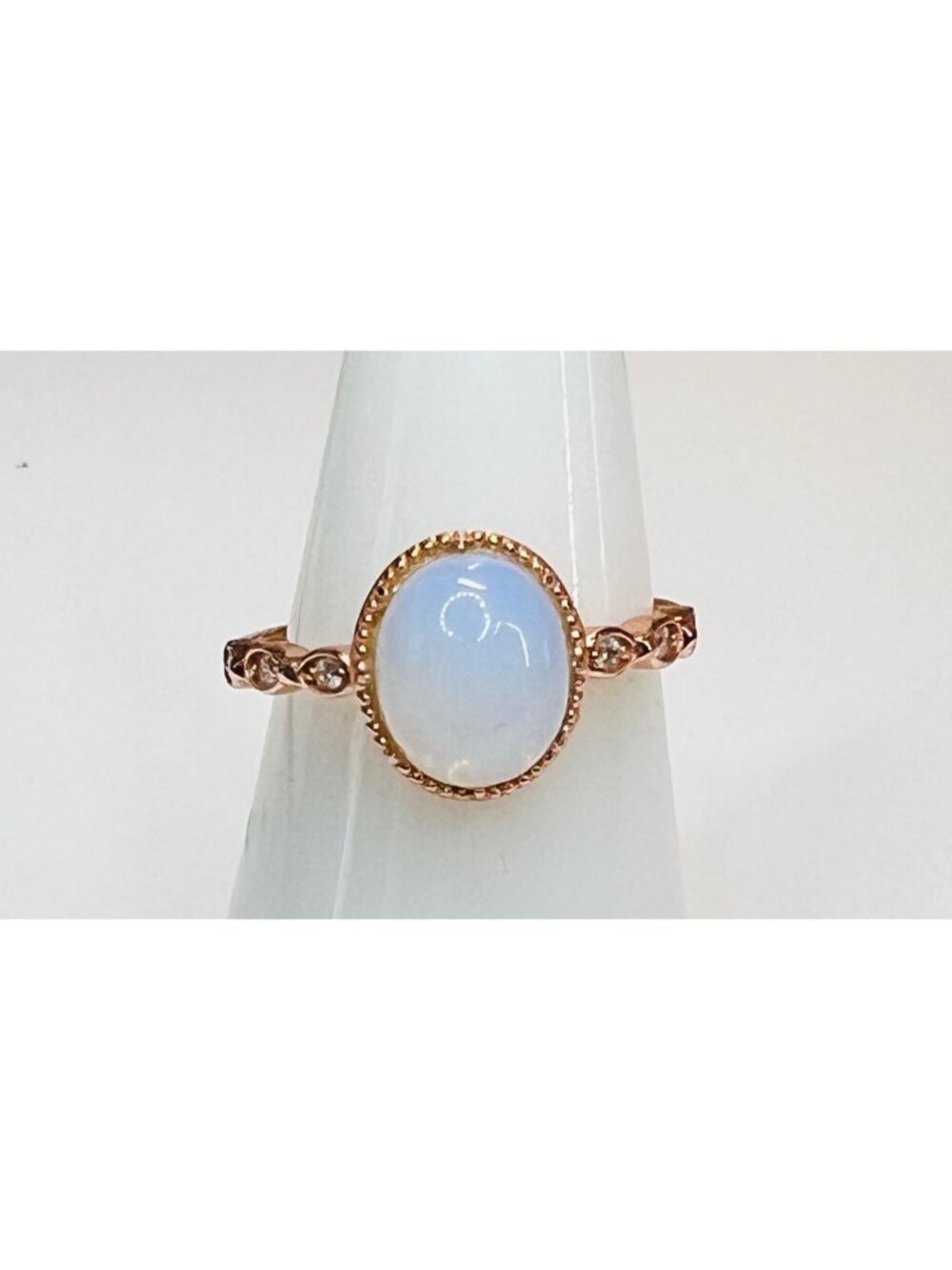 Size 6.5 rose gold color ring with bluish white opal looking stone stamped 925